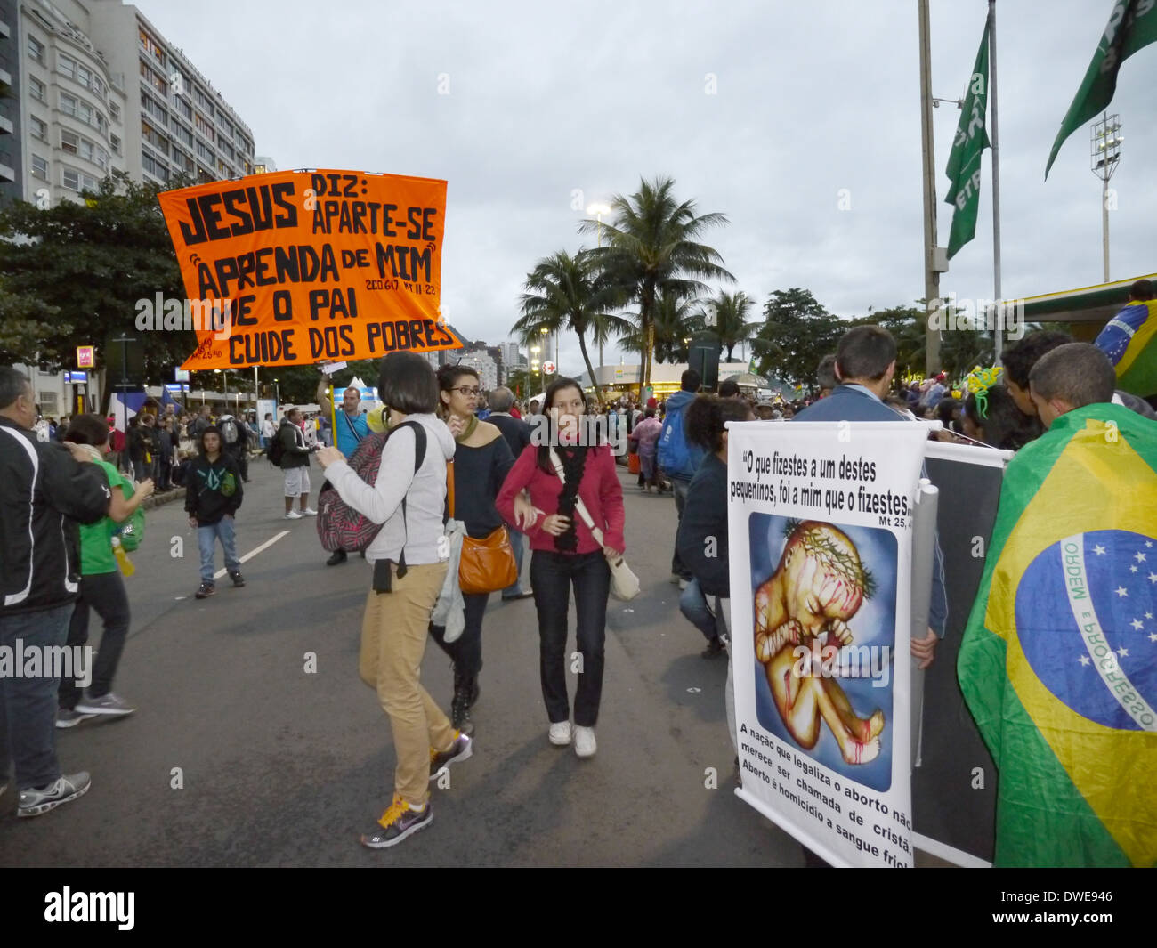 Pilgrims marching along Avenida Atlantic which runs beside Copacabana beach. Anti abortion demonstartor. Stock Photo