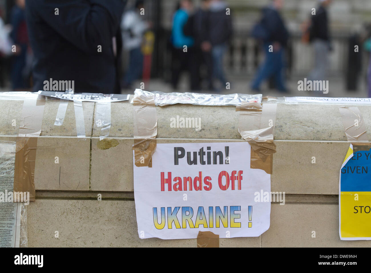 Westminster London ,UK. 6th March 2014. Ukrainian protesters continue to hold a 24hour shift protest outside Downing Street with placards following the Russian military intervention in the Crimea demanding on the British Government to keep its promises on the Budapest memorandum on Security Assurances signed in 1994.The Memorandum included security assurances against threats or use of force against the territorial integrity or political independence of Ukraine and as a result Ukraine gave up its stockpile of Nuclear weapons between 1994 and 1996. Credit:  amer ghazzal/Alamy Live News Stock Photo