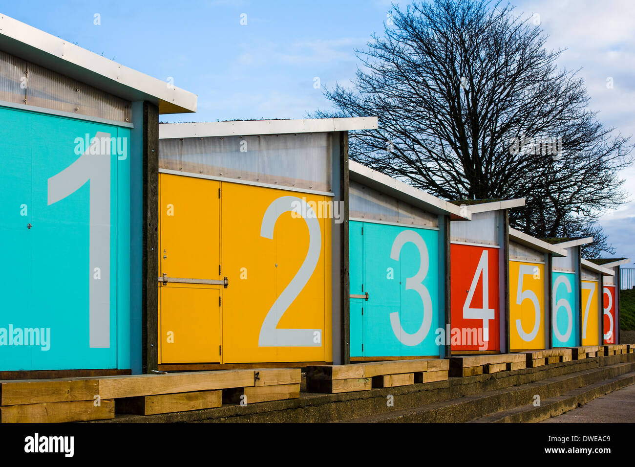 Beach huts with bright coloured doors. Stock Photo