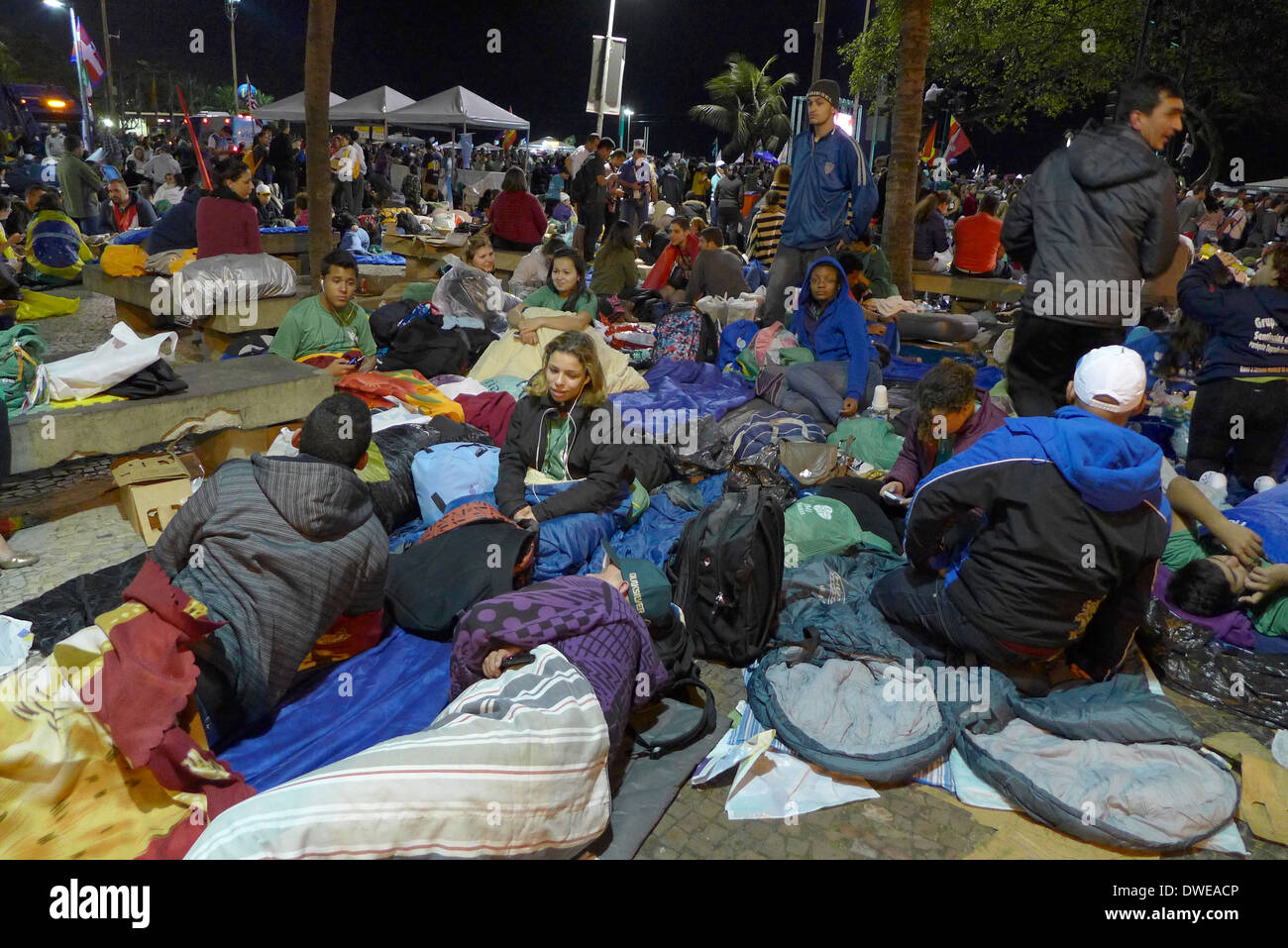 Pilgrims camped out on the streets of Copacabana for the all night Saturday vigil, leading to final mass on Sunday 28/6/13 Stock Photo