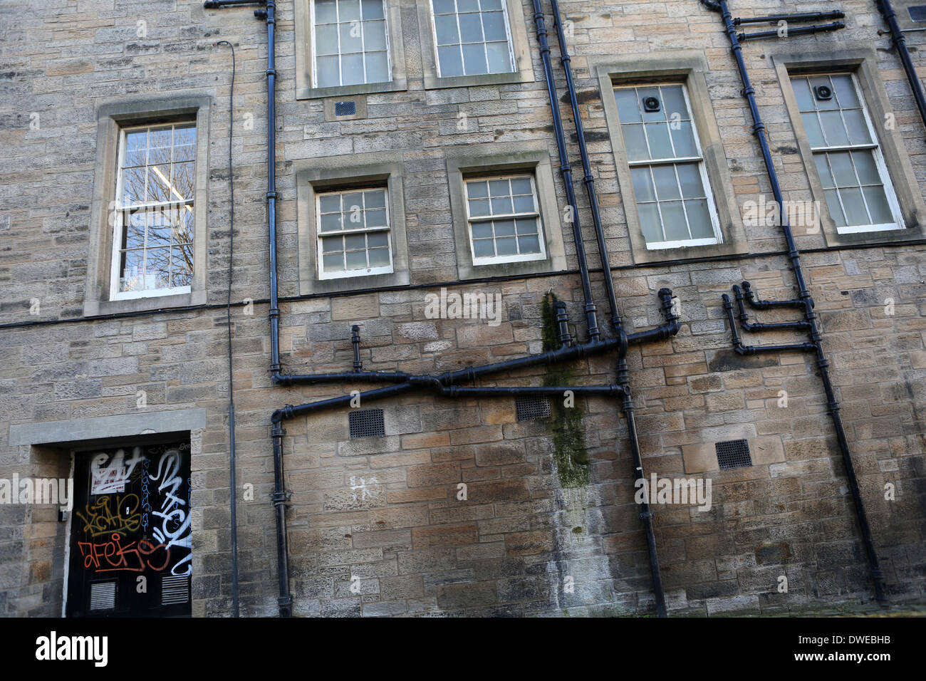 Detail brick wall - Windows and Pipes - West Norton Place - Edinburgh - Lothian - Scotland - UK Stock Photo