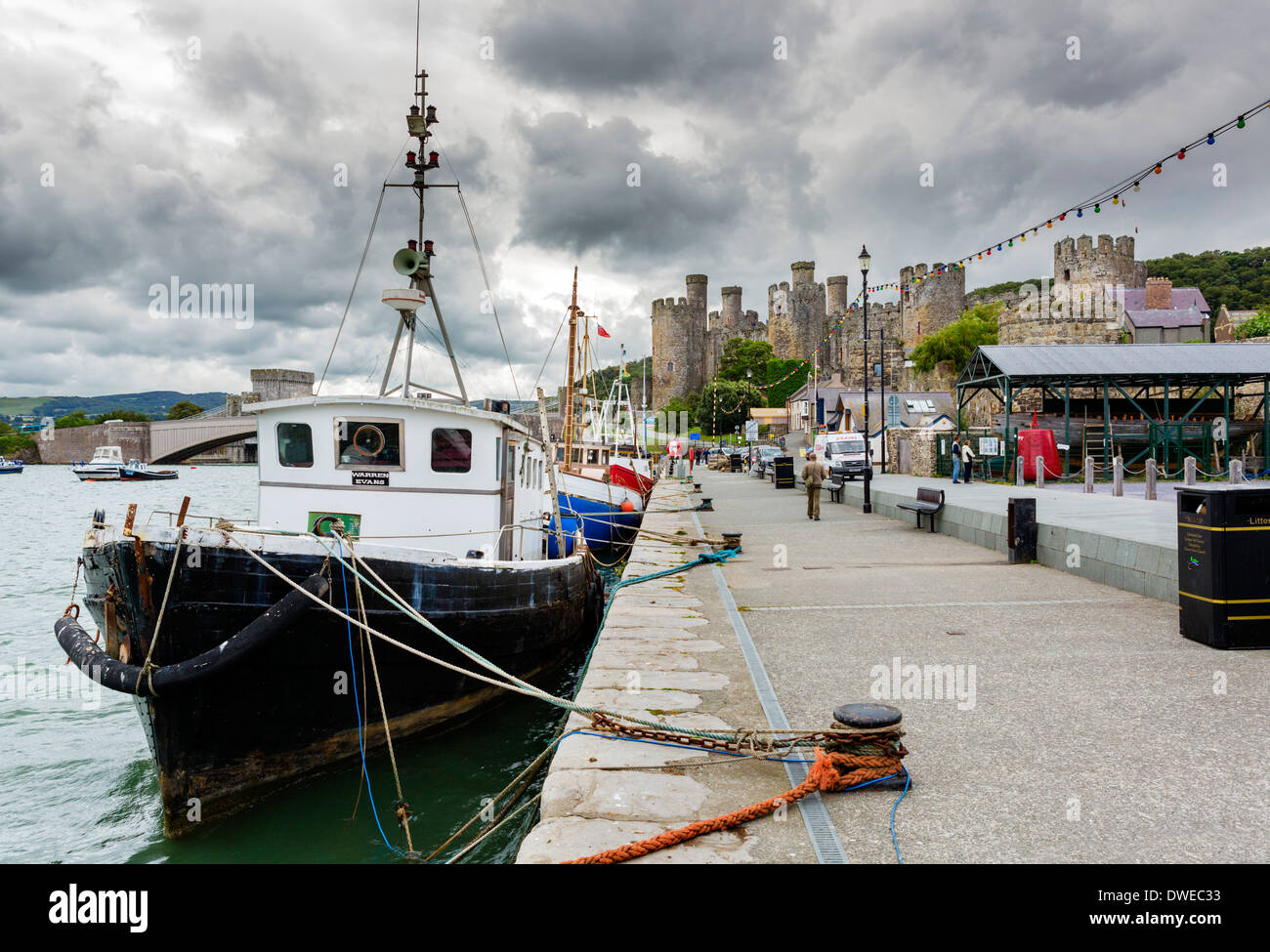 Fishing boats moored in the harbour along Lower Gate Street with Conwy