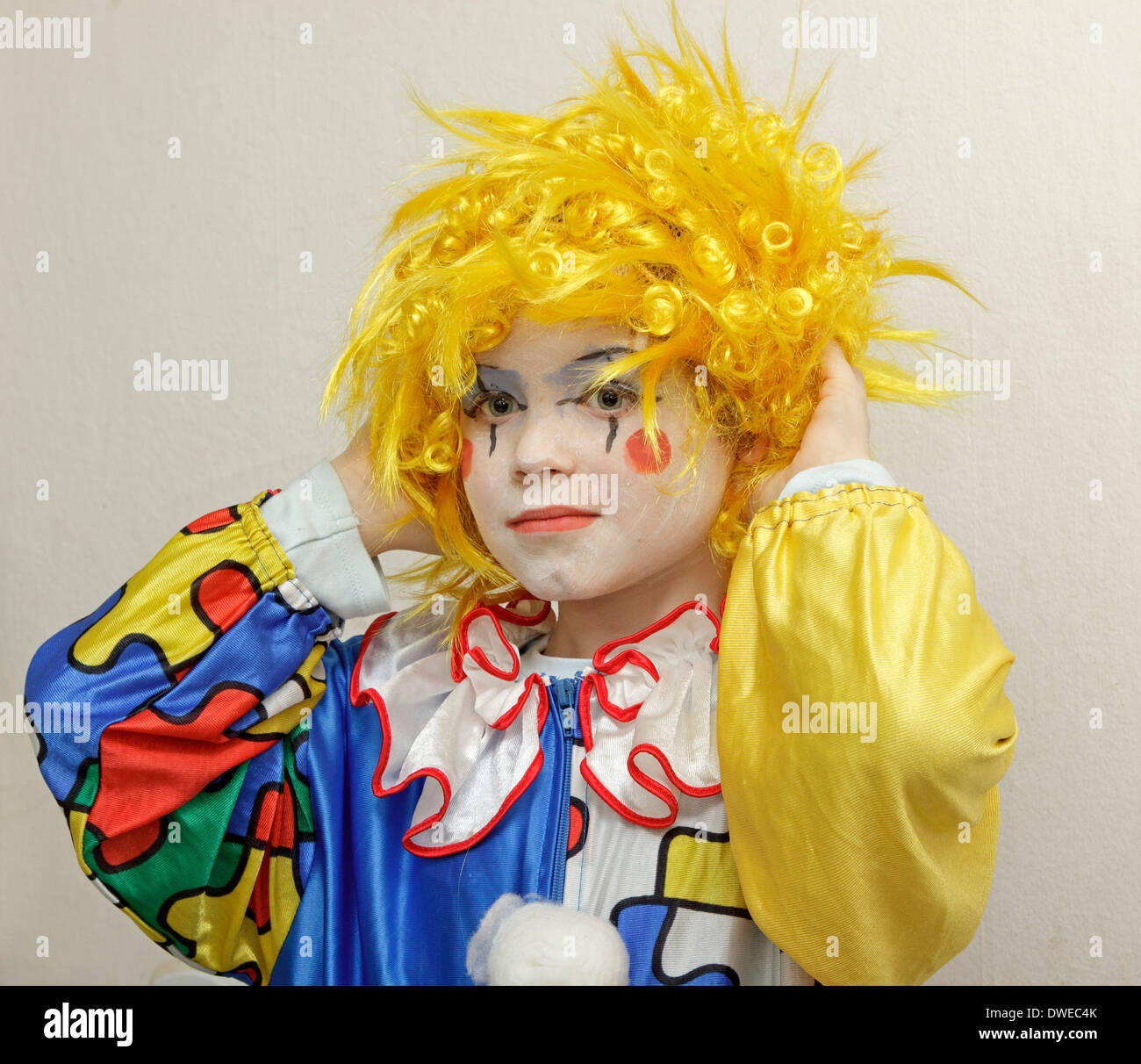 young boy dressed up as a clown Stock Photo