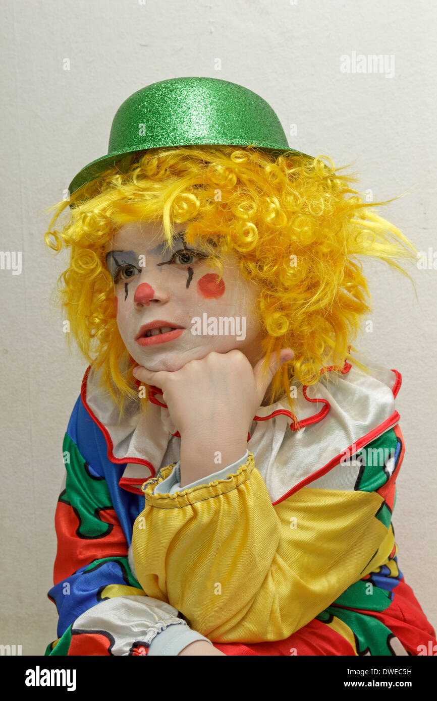 young boy dressed up as a clown Stock Photo