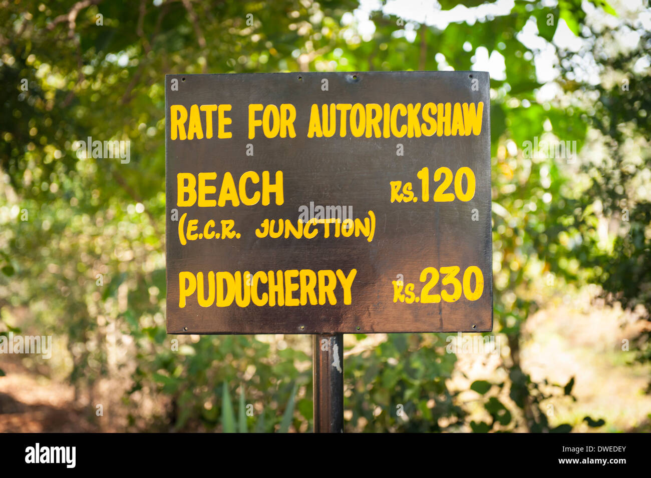 India Tamil Nadu Pondicherry Puducherry Auroville Matri Mandir meditation spiritual centre center park odd strange sign signs Autorickshaw prices rate Stock Photo