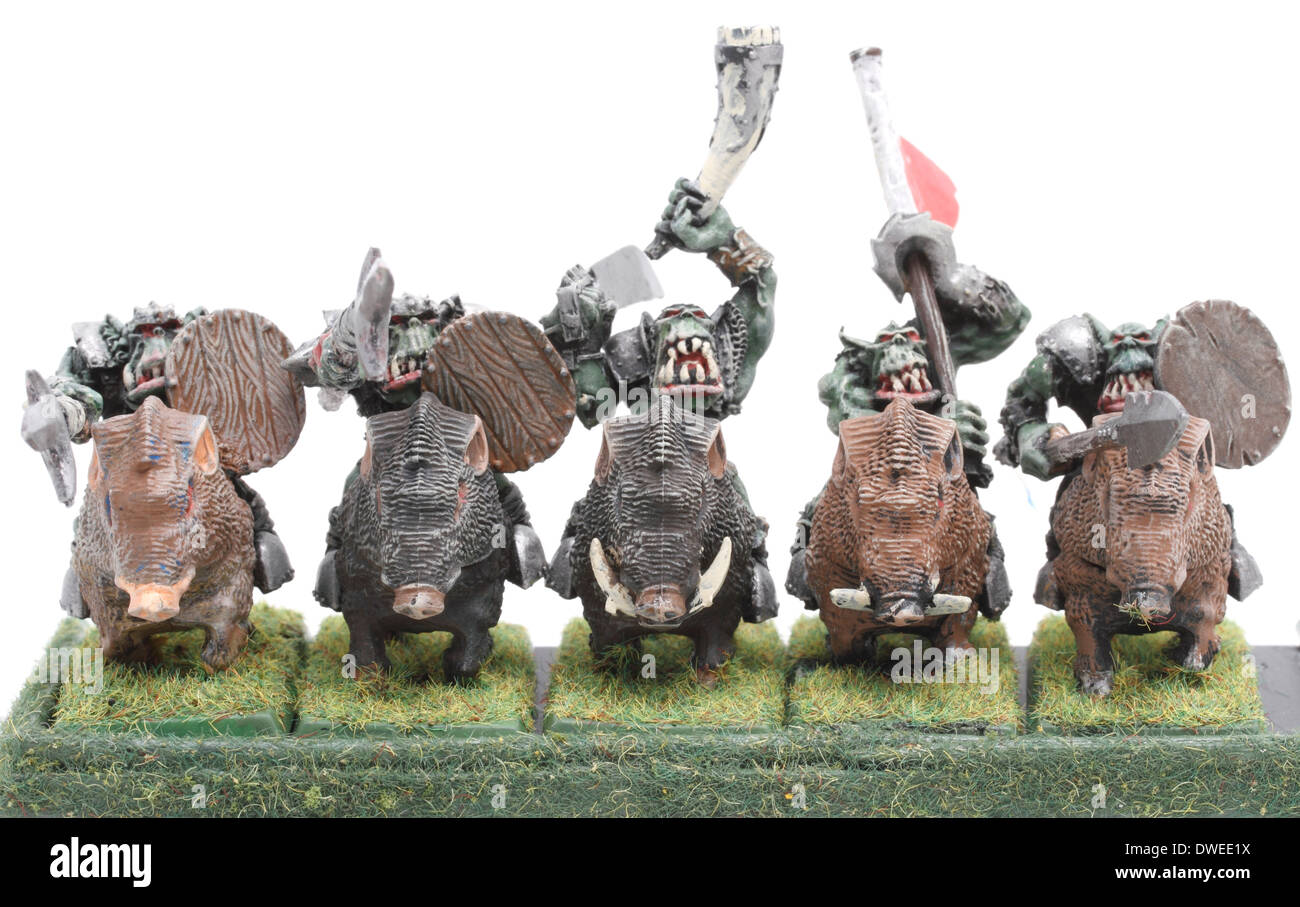 Orc Boar Boyz mounted on war Boars, with banner bearer and musican (horn) painted by photographer Stock Photo