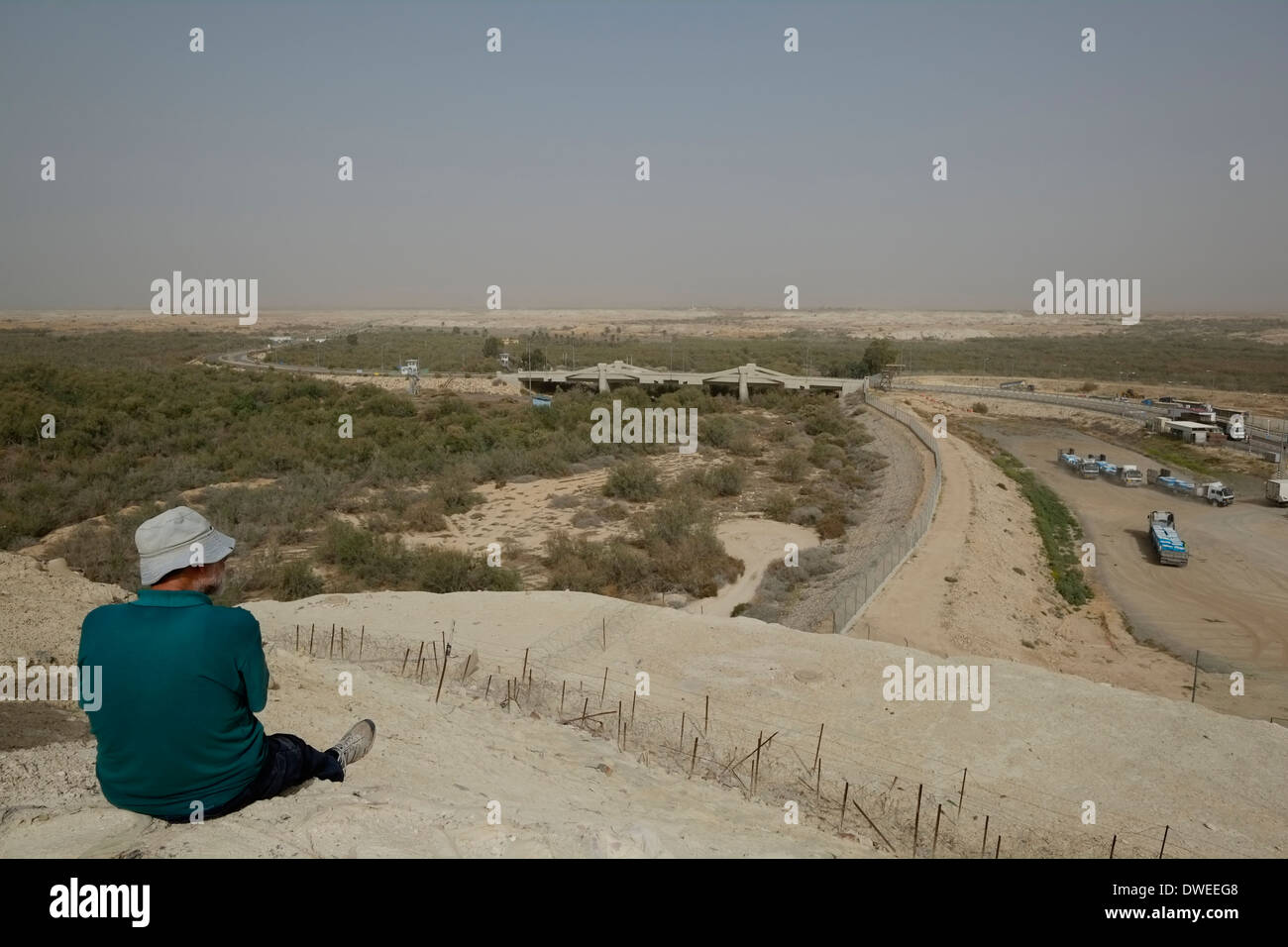 Israeli civilian gazing from a former military post at Allenby Bridge also known as King Hussein bridge crossing point between Israel and Jordan at the Jordan Valley Stock Photo