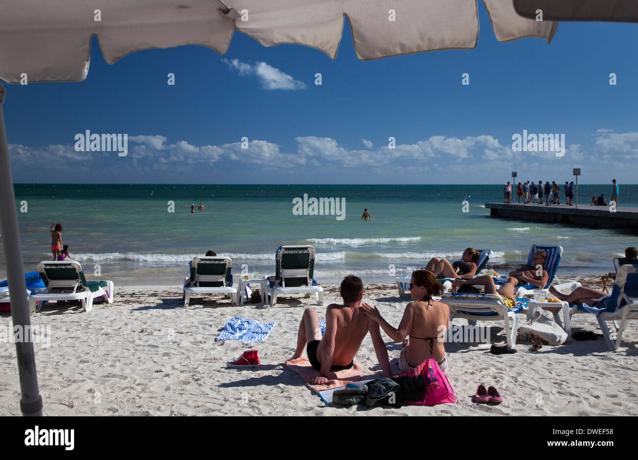 Key West, Florida - Tourists on South Beach, the southernmost beach in the continental United States. Stock Photo