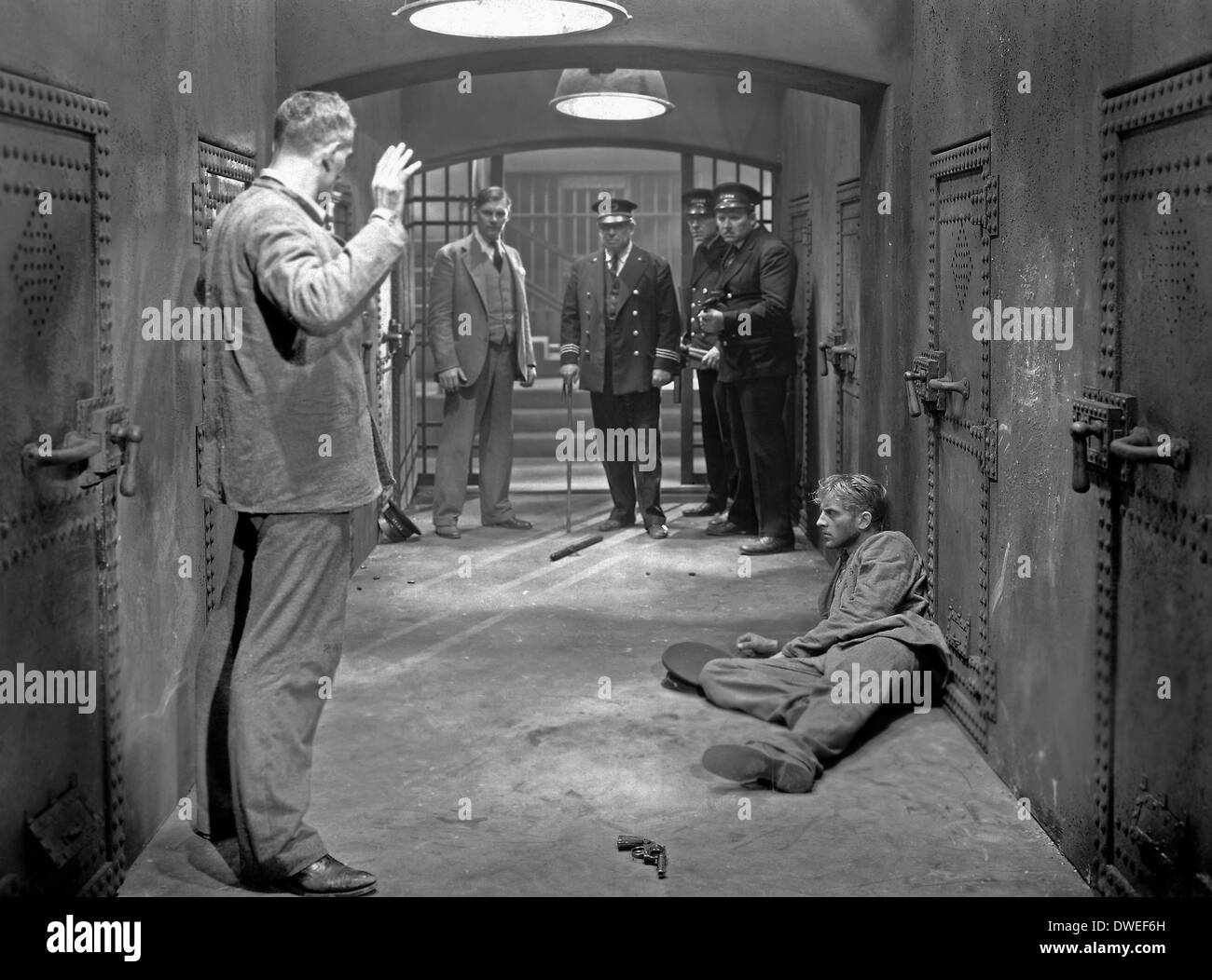 Boris Karloff, Walter Huston, De Witt Jennings and Phillips Holmes, on-set of the Film, 'The Criminal Code', 1931 Stock Photo