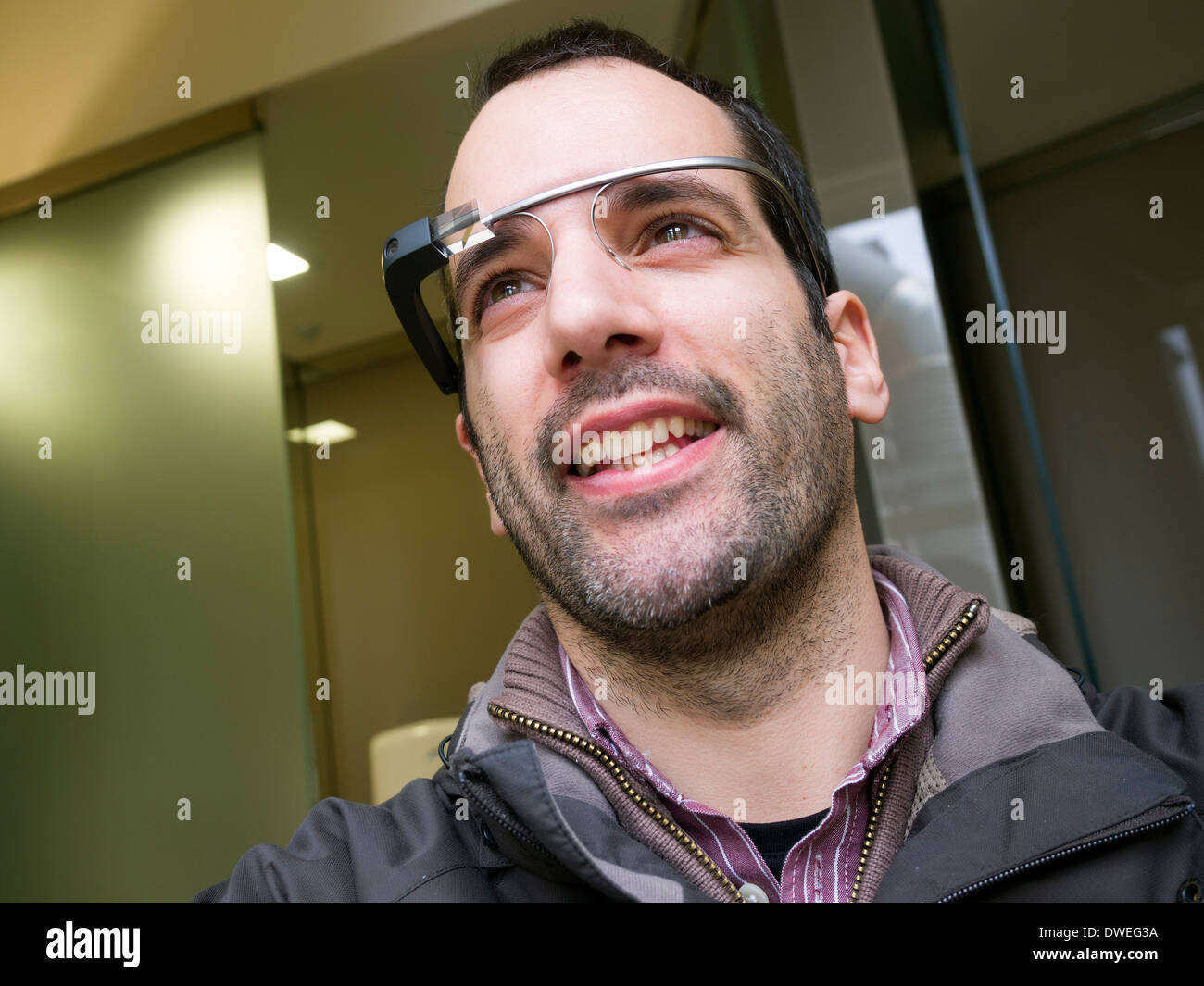 Young man wearing Google Glass Stock Photo