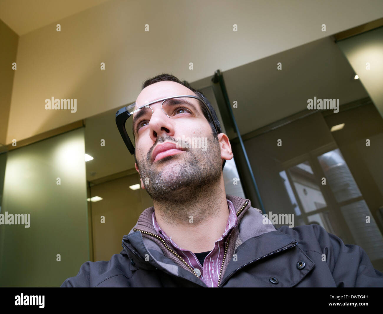 Young man wearing Google Glass Stock Photo