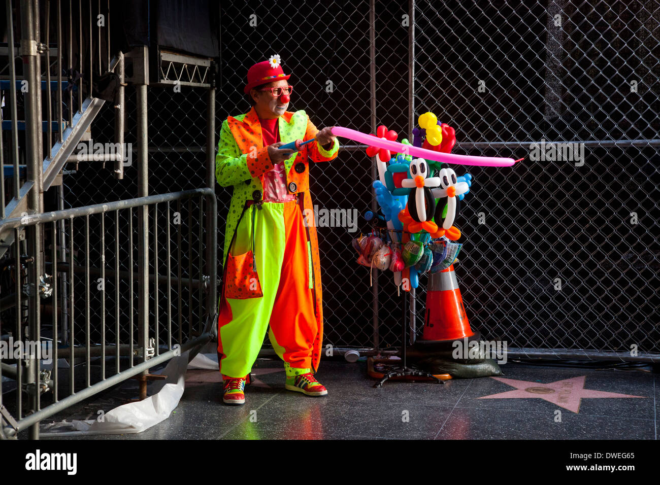 Clown making balloon animals, Hollywood Boulevard, Hollywood, Los Angeles, California, United States of America Stock Photo