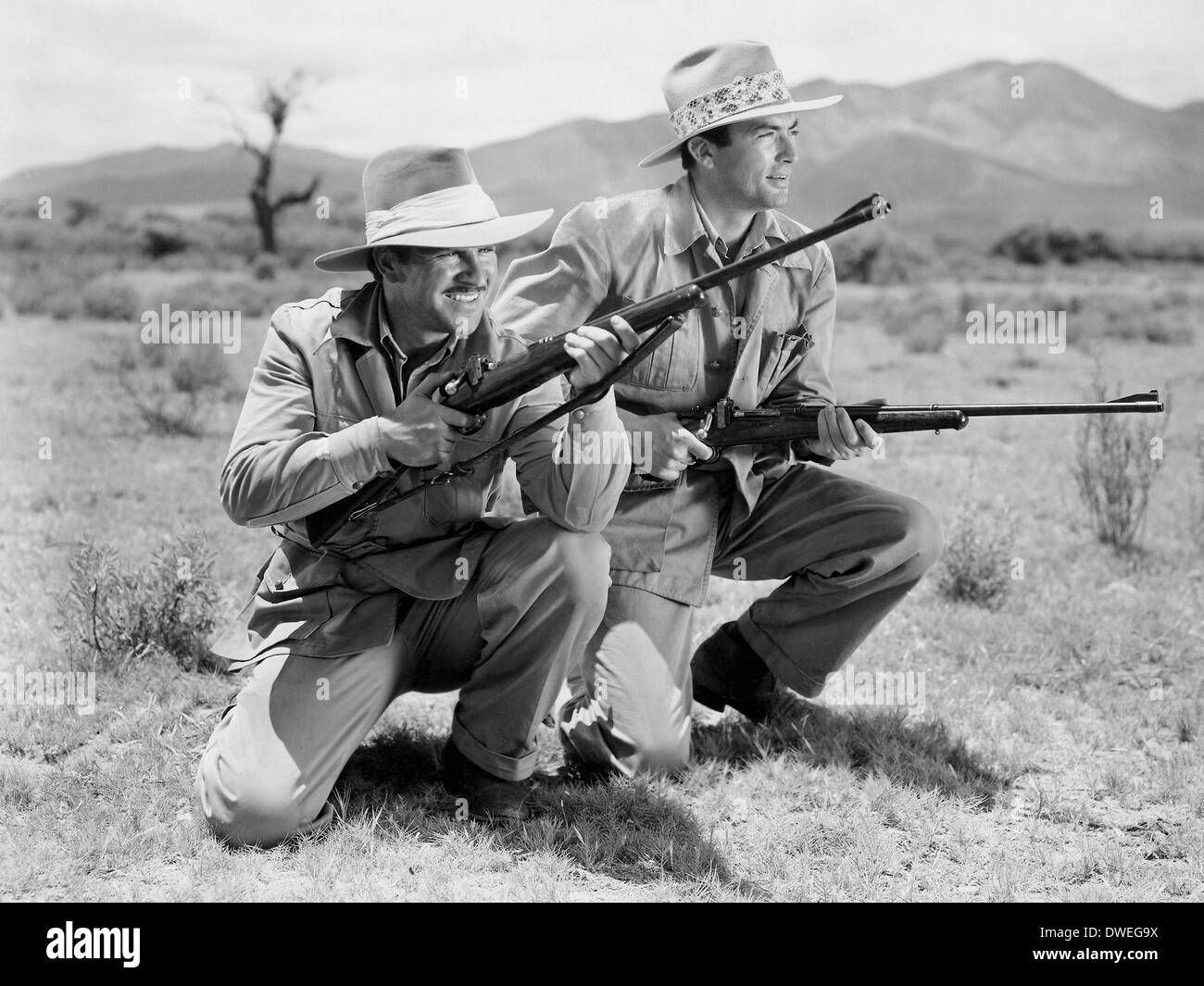 Robert Preston and Gregory Peck, on-set of the Film, 'The Macomber Affair' directed by Zoltan Korda, 1947 Stock Photo