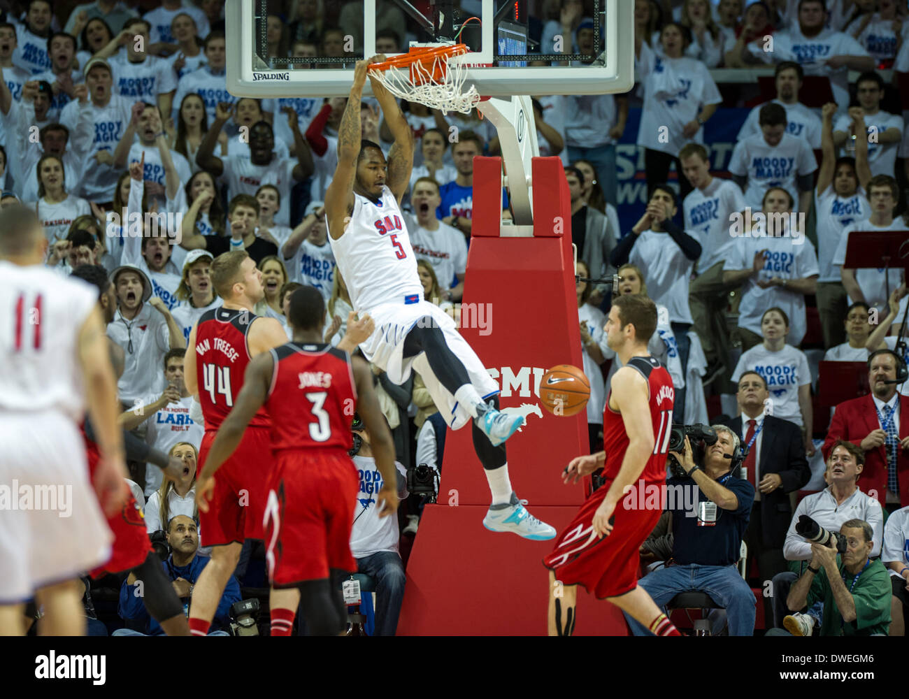Southern Methodist Mustangs forward Markus Kennedy (5) goes up for a dunk of a NCAA mens basketball game between the Louisville Cardinals and the SMU Mustangs, Wednesday, March 5th, 2014 @ Moody Coliseum in Dallas, Texas.Louisville wins 84-71. Stock Photo