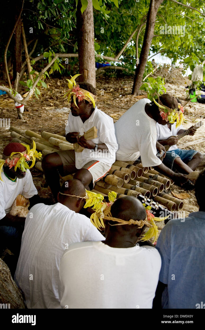 A Ghizo Island string band performs for tourists, Kennedy Island, Solomon Islands, South Pacific Stock Photo