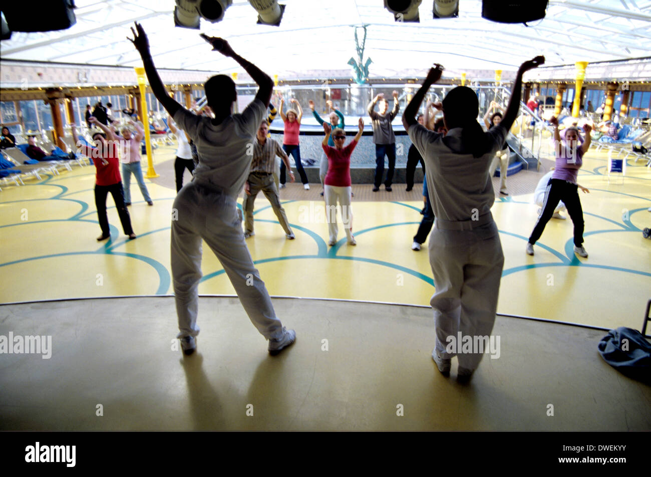 recreation directors lead aerobic dance class on Costa Cruise ship on Canada Cruise Stock Photo