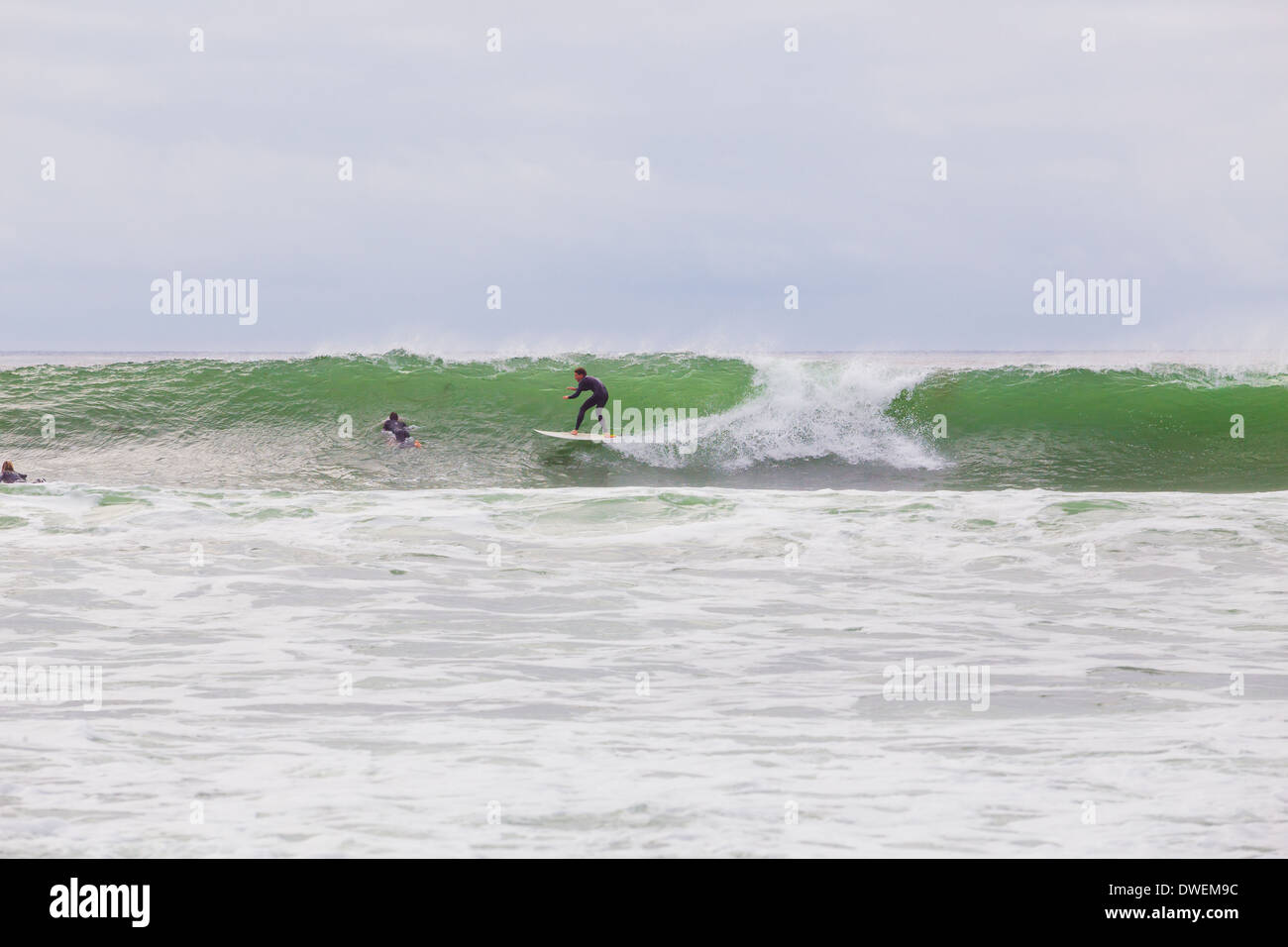 La Jolla, CA - January 30, 2014: Unknown surfer riding a big wave during a surf session in La Jolla California. Stock Photo