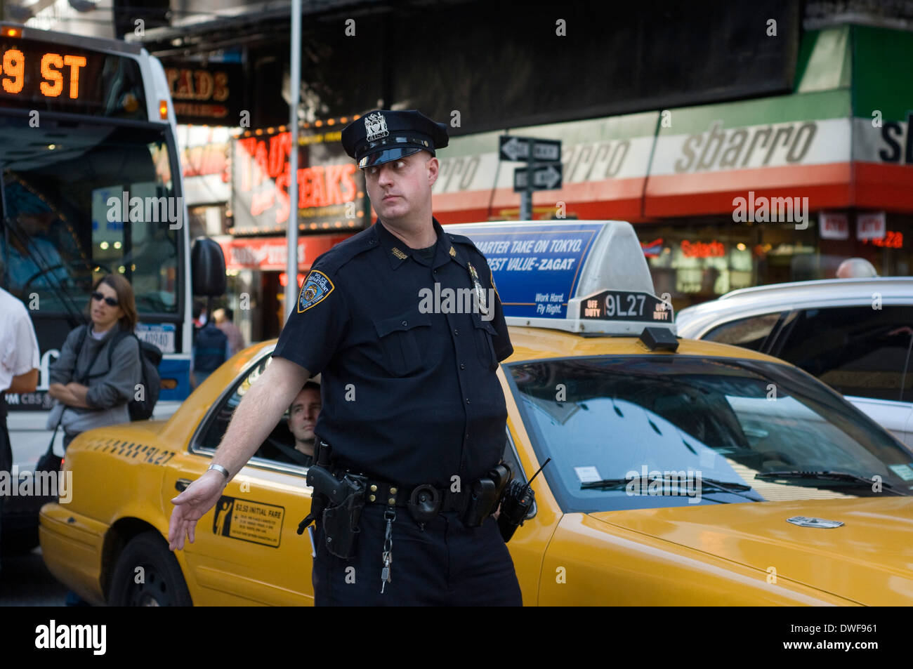 A policeman directs traffic near Times Square. 1560 Broadway, between 46th and 47th Street Stock Photo