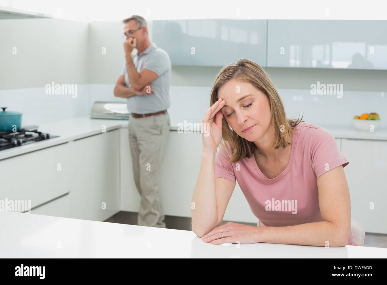 Couple not talking after an argument in kitchen Stock Photo