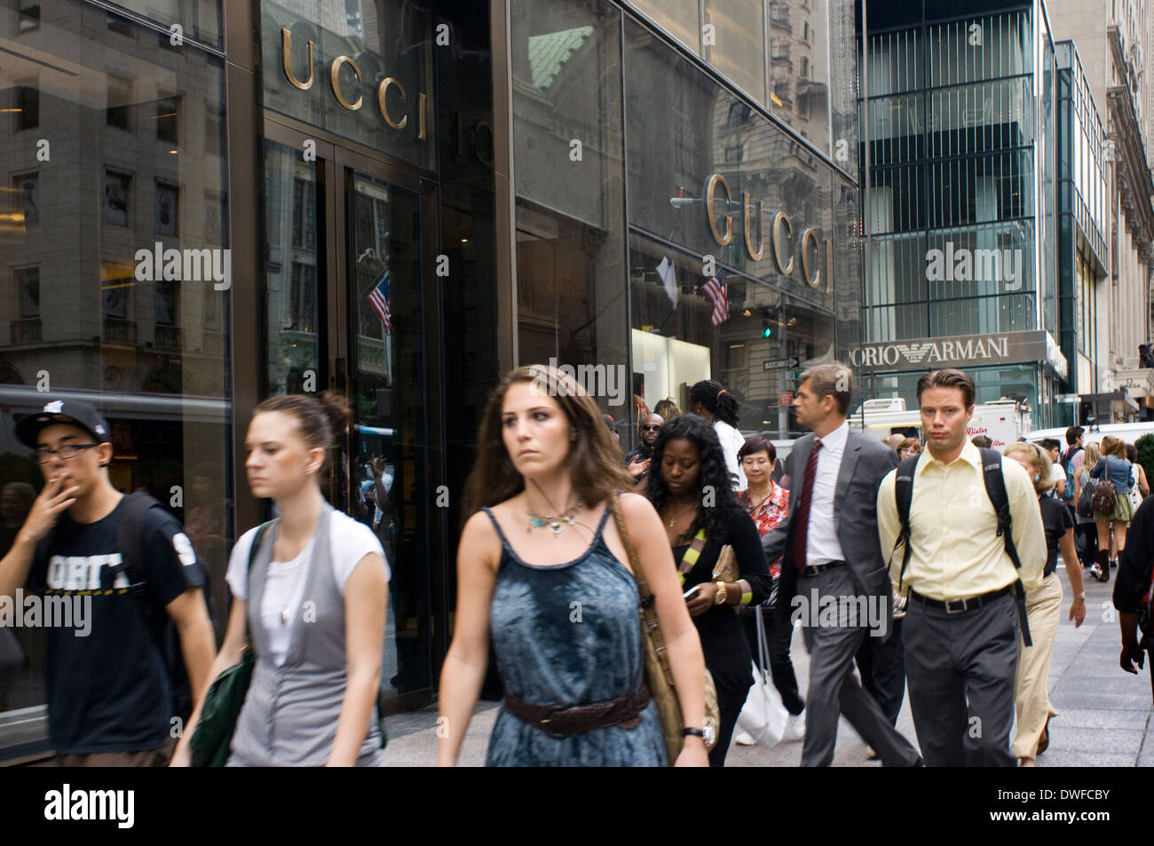 People strolling along Fifth Avenue to showcase Gucci store. The luxury shops associated with Fifth Avenue began to appear when Stock Photo