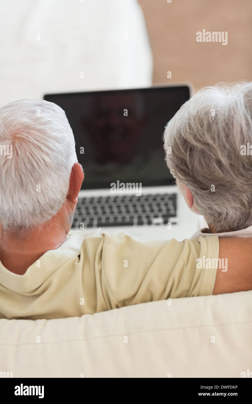 Happy senior couple using the laptop together Stock Photo