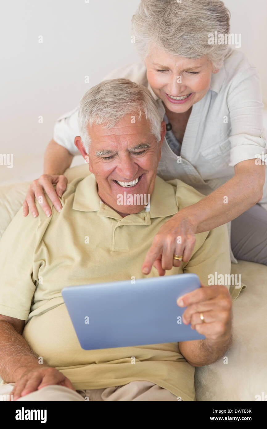 Cheerful senior couple using the digital tablet together Stock Photo