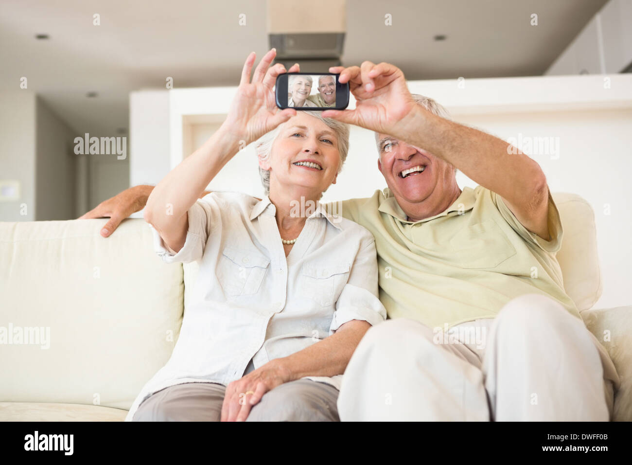 Senior couple taking a selfie with smartphone Stock Photo