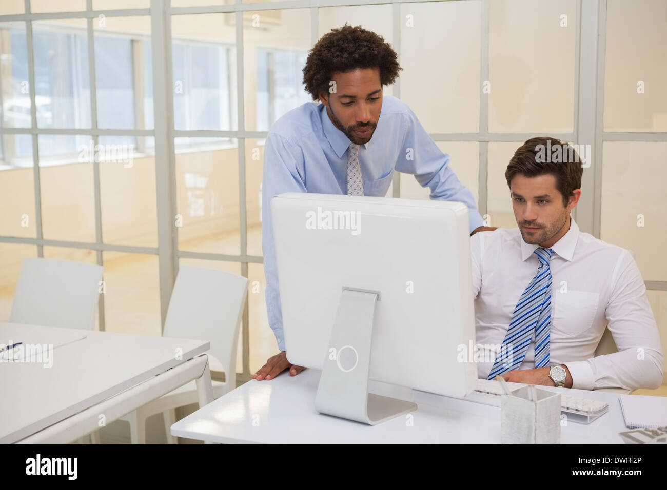 Businessmen working on computer in office Stock Photo