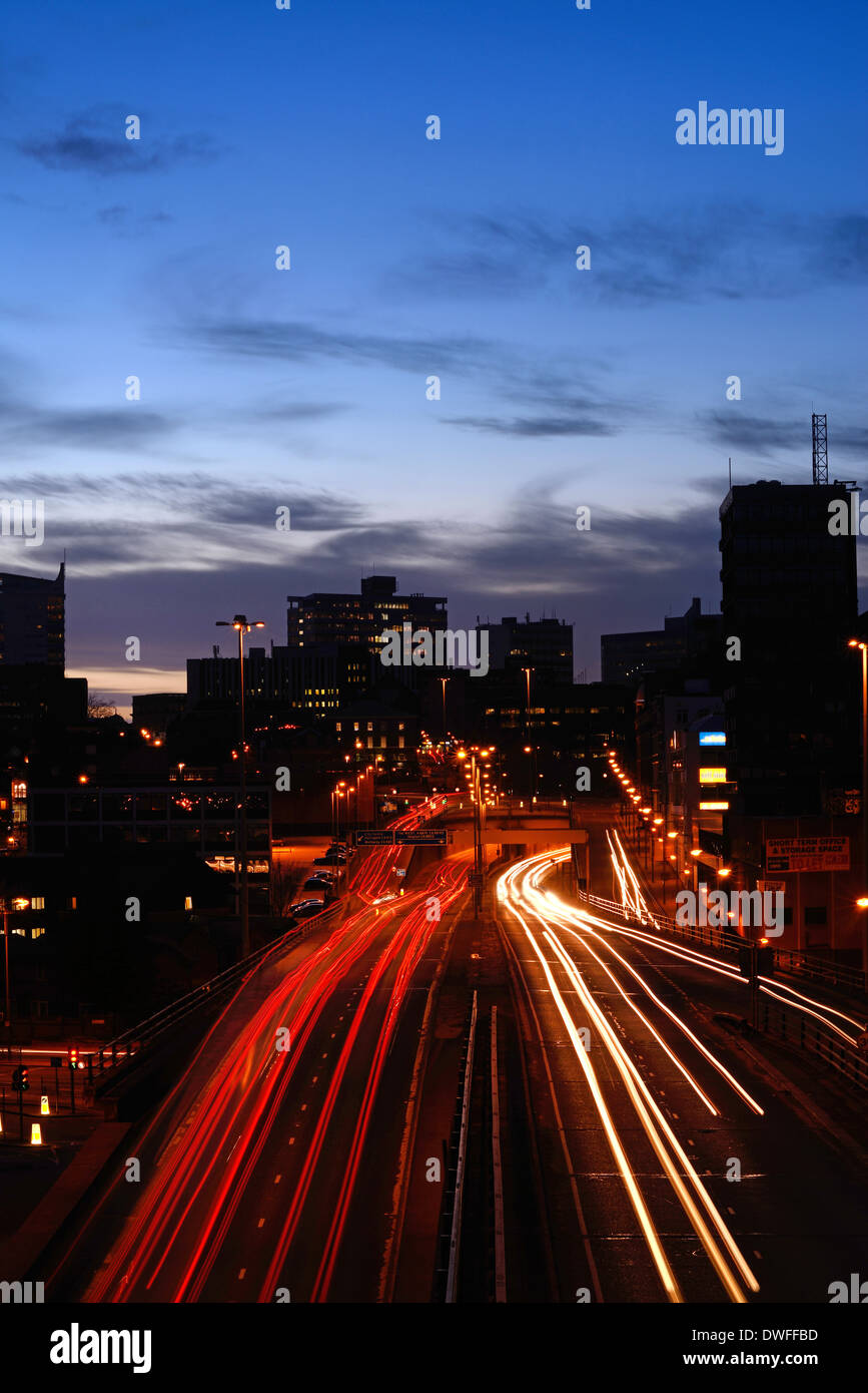 traffic trails of traffic heading too and from the city of leeds at dusk leeds yorkshire uk Stock Photo