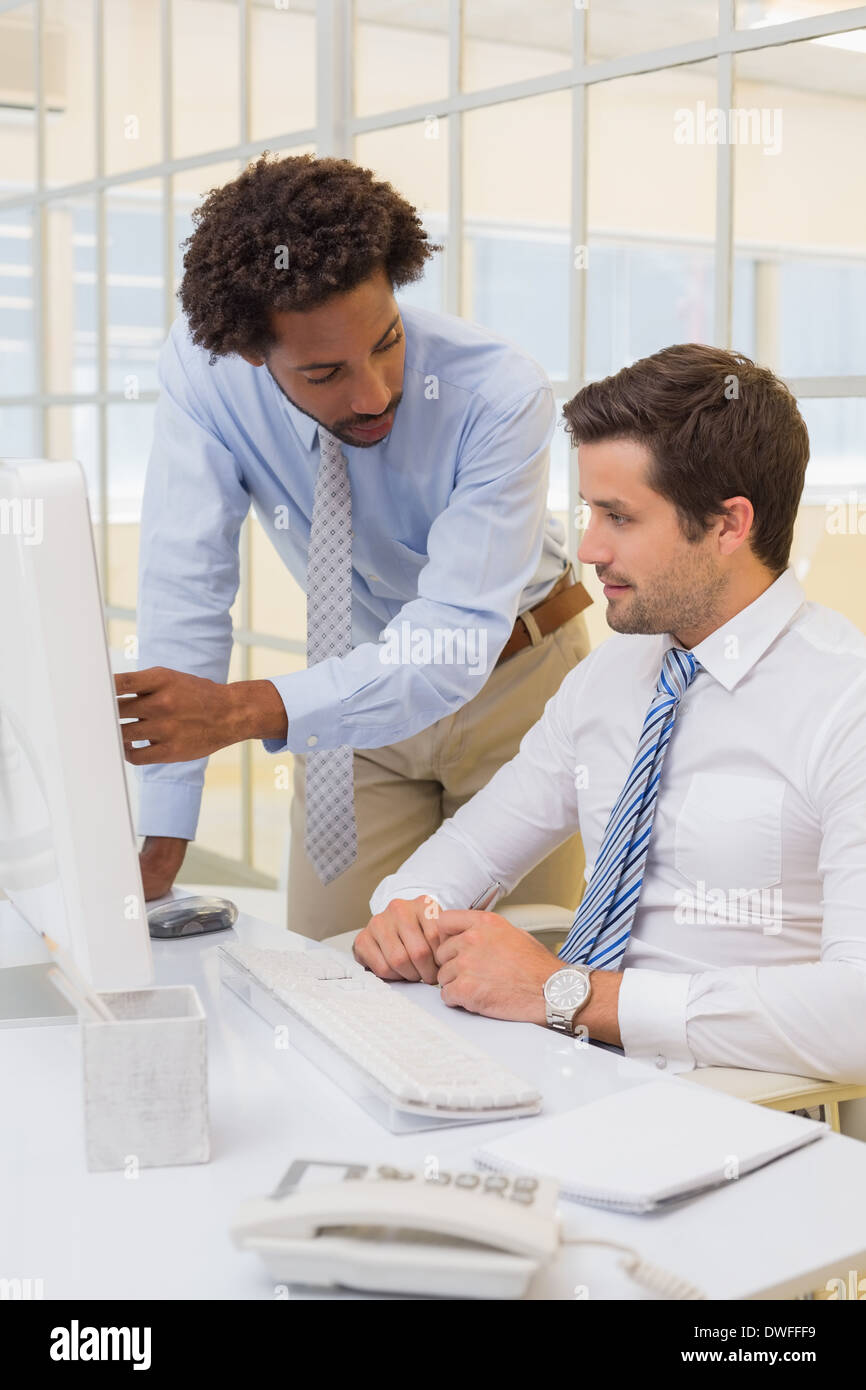 Businessmen working on computer in office Stock Photo
