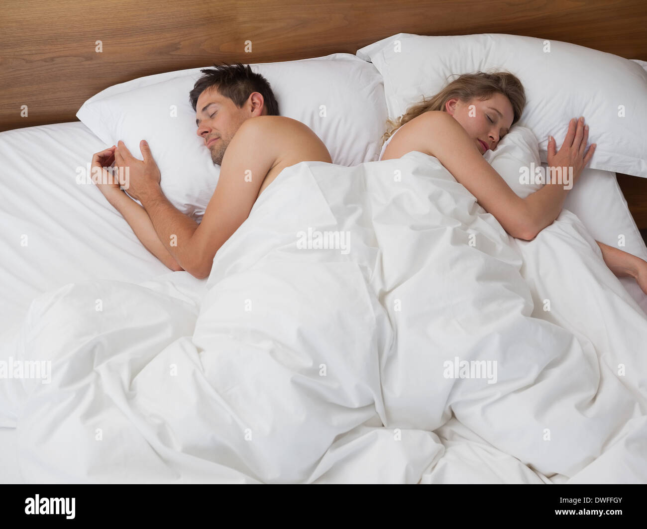 High angle view of couple sleeping in bed Stock Photo - Alamy