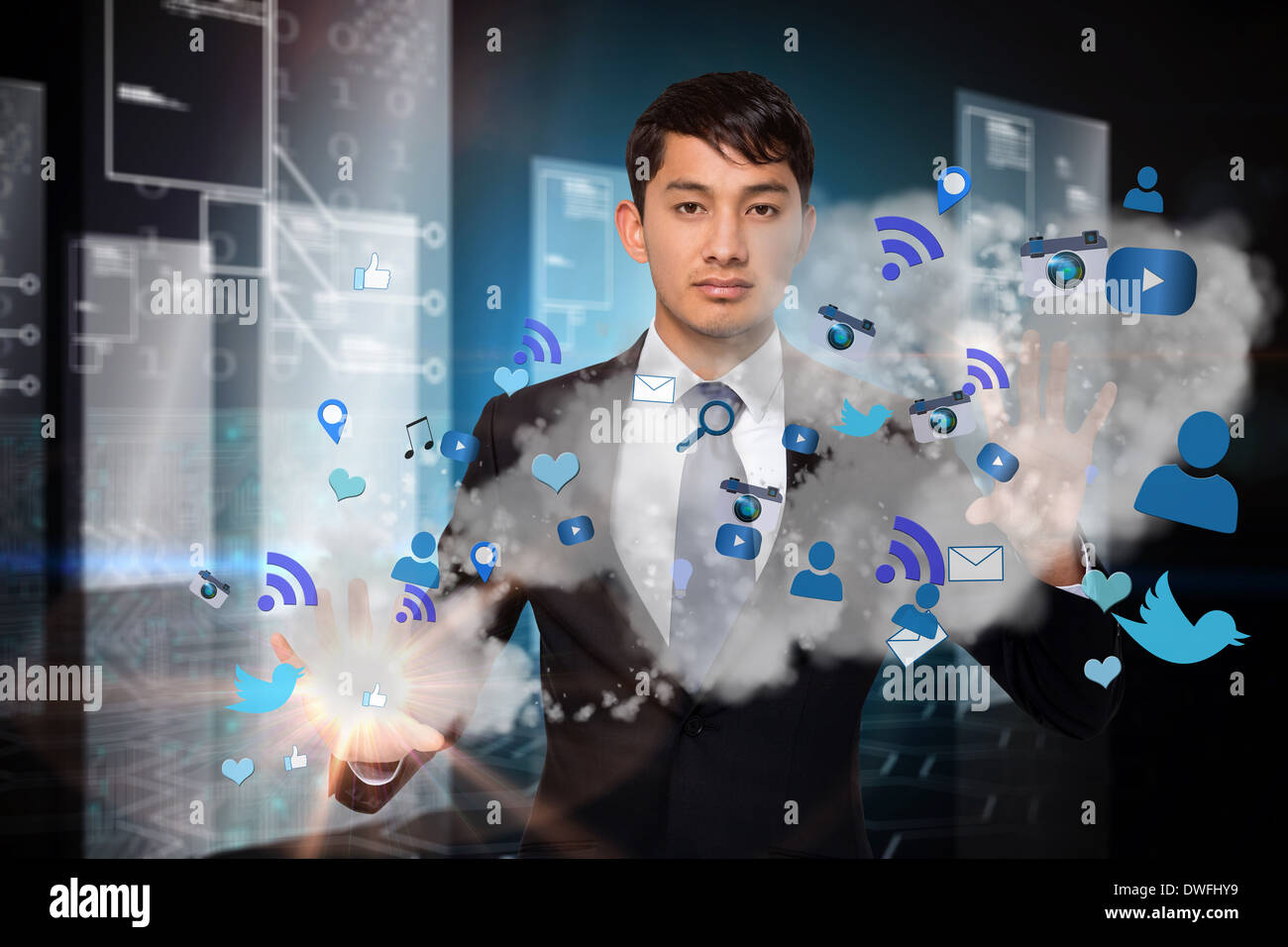 Serious businessman touching apps in cloud Stock Photo