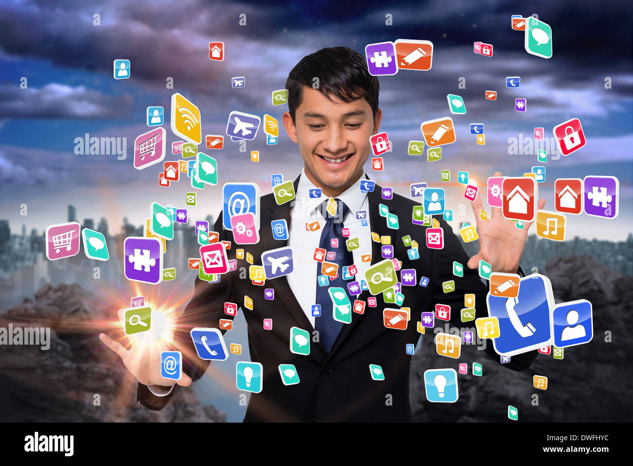 Smiling businessman touching apps Stock Photo