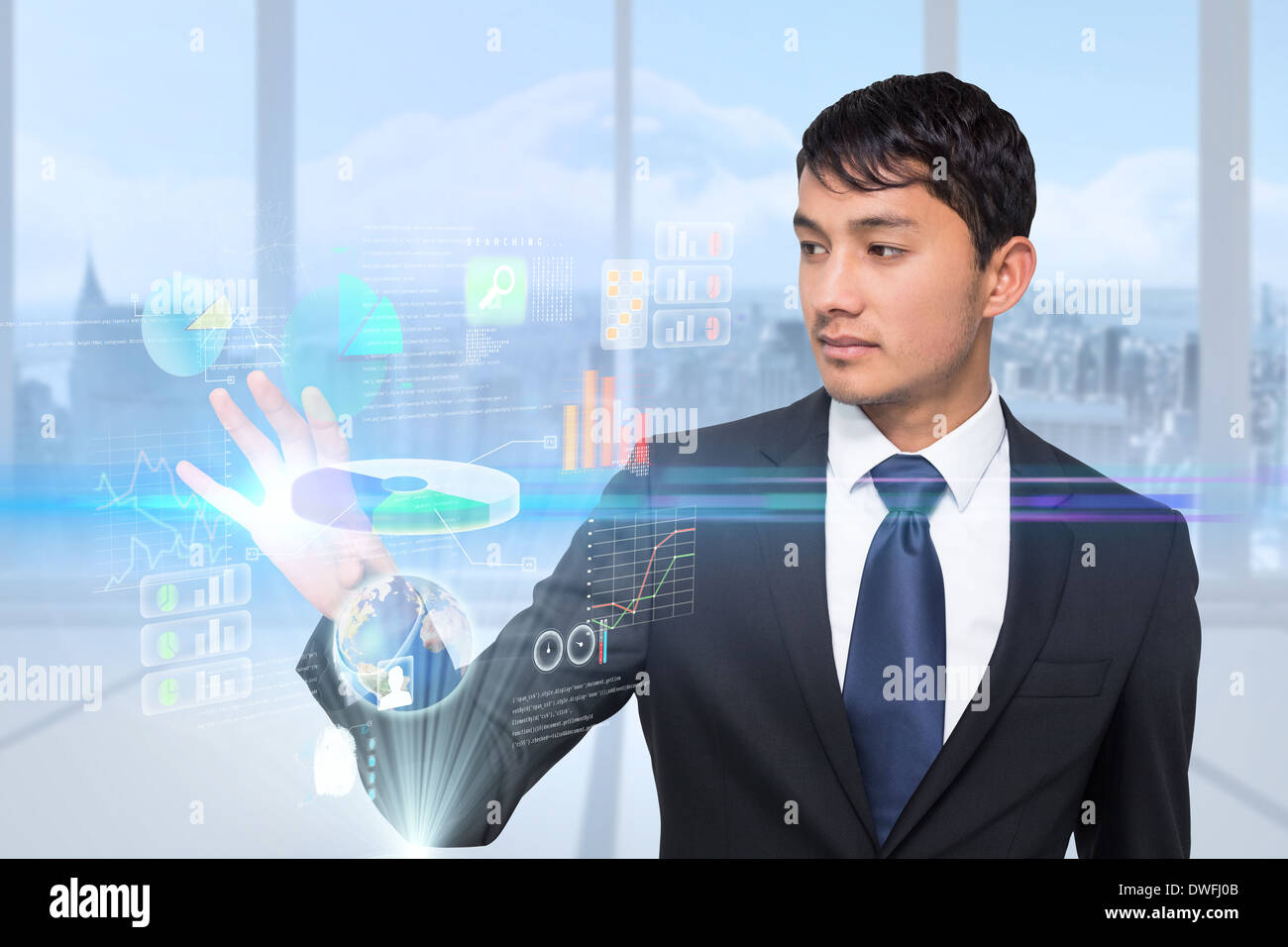 Asian businessman touching interface Stock Photo