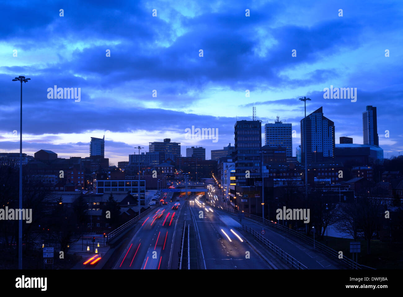 traffic trails of traffic heading too and from the city of leeds at dusk leeds yorkshire uk Stock Photo