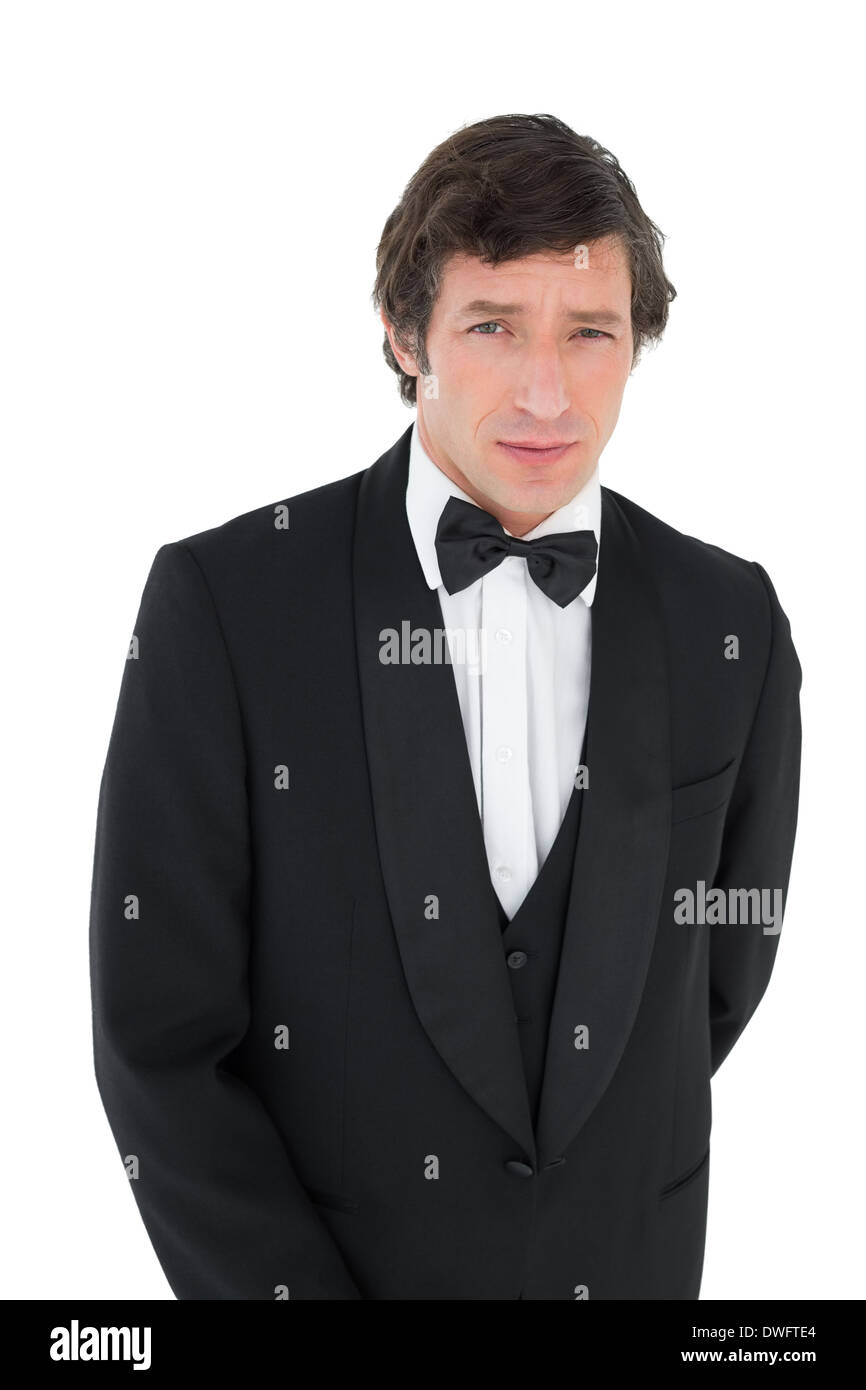 Portrait of groom in tuxedo Stock Photo