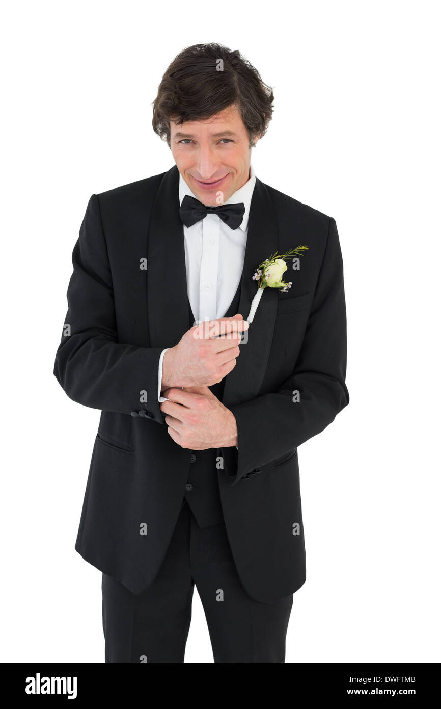 Smiling groom in tuxedo getting ready Stock Photo