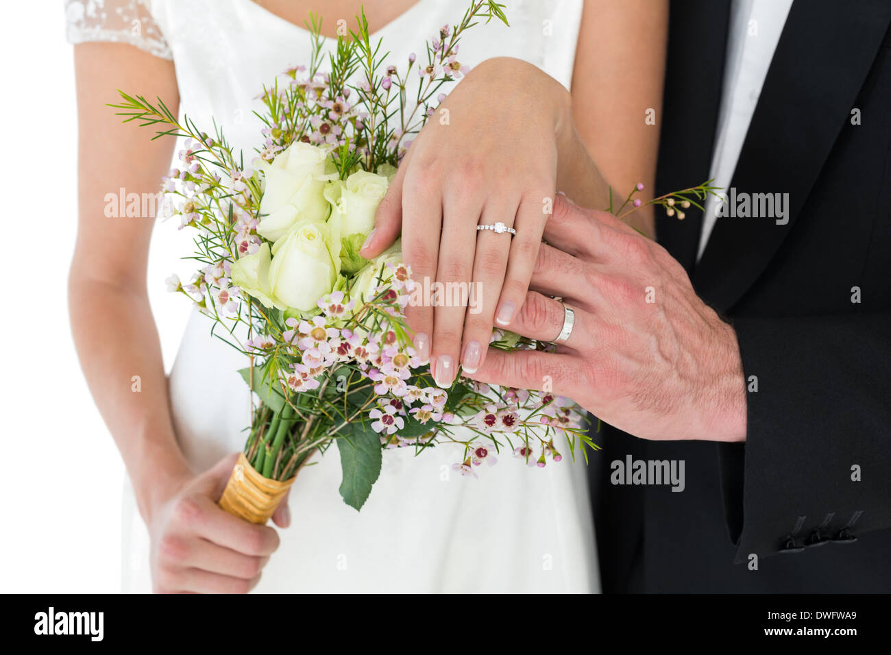 Newly wed couple showing wedding rings Stock Photo
