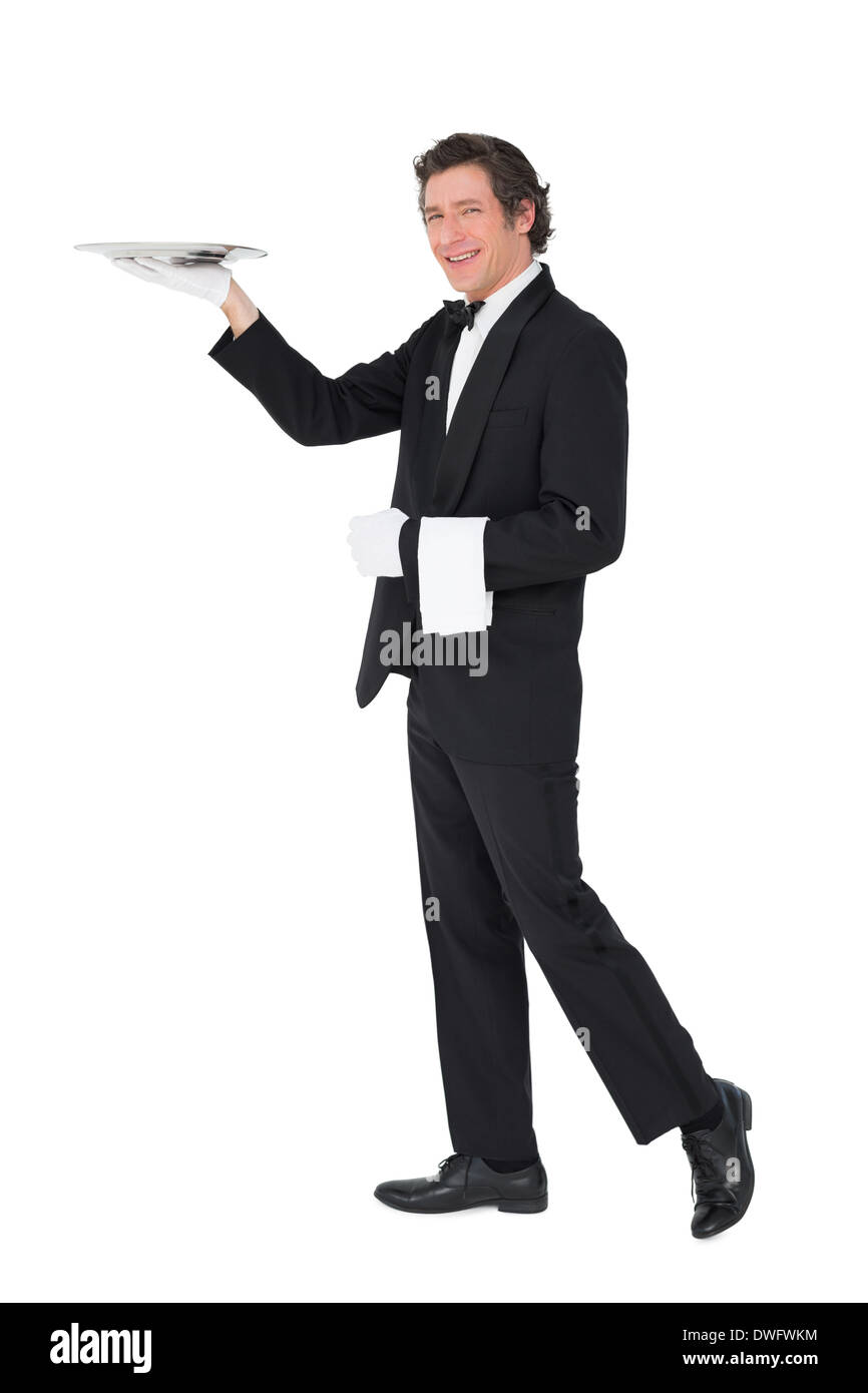 Server carrying tray over white background Stock Photo Alamy