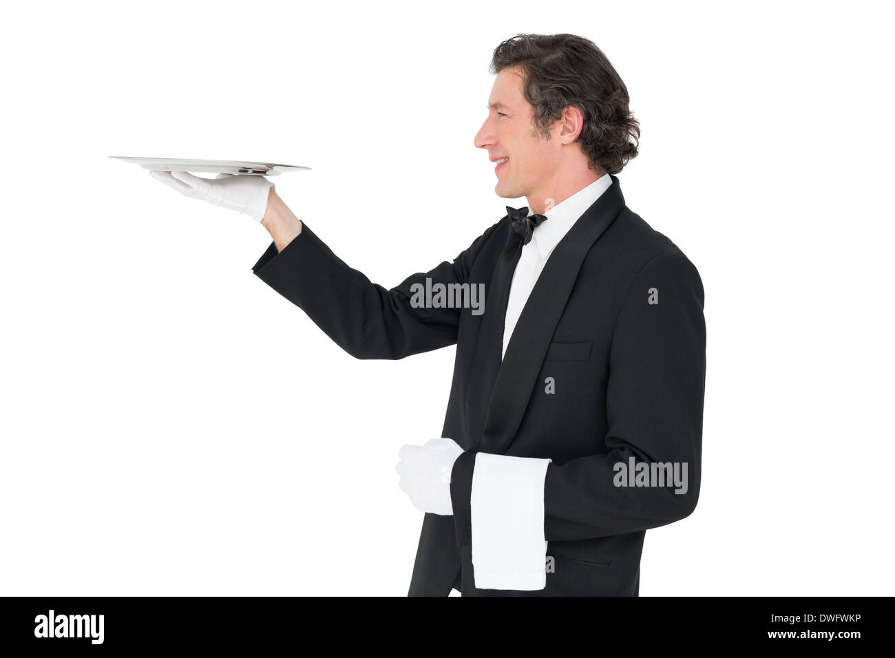 Waiter carrying tray against white background Stock Photo Alamy