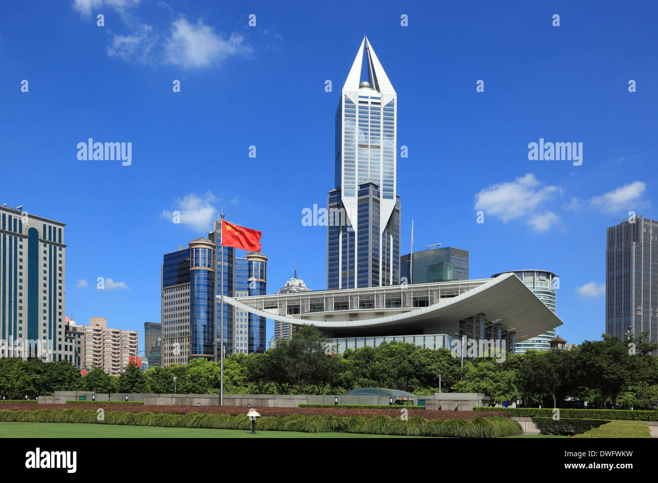 Downtown Shanghai, China, with blue sky and Chinese national flag Stock Photo