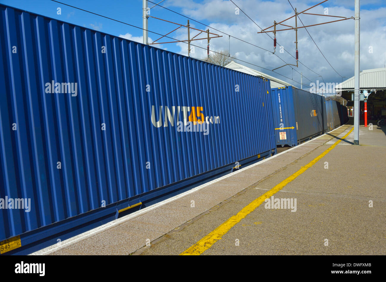 UNIT45.com. Rail freight containers. Oxenholme Rail Station, West Coast Main Line, Cumbria, England United Kingdom, Europe. Stock Photo