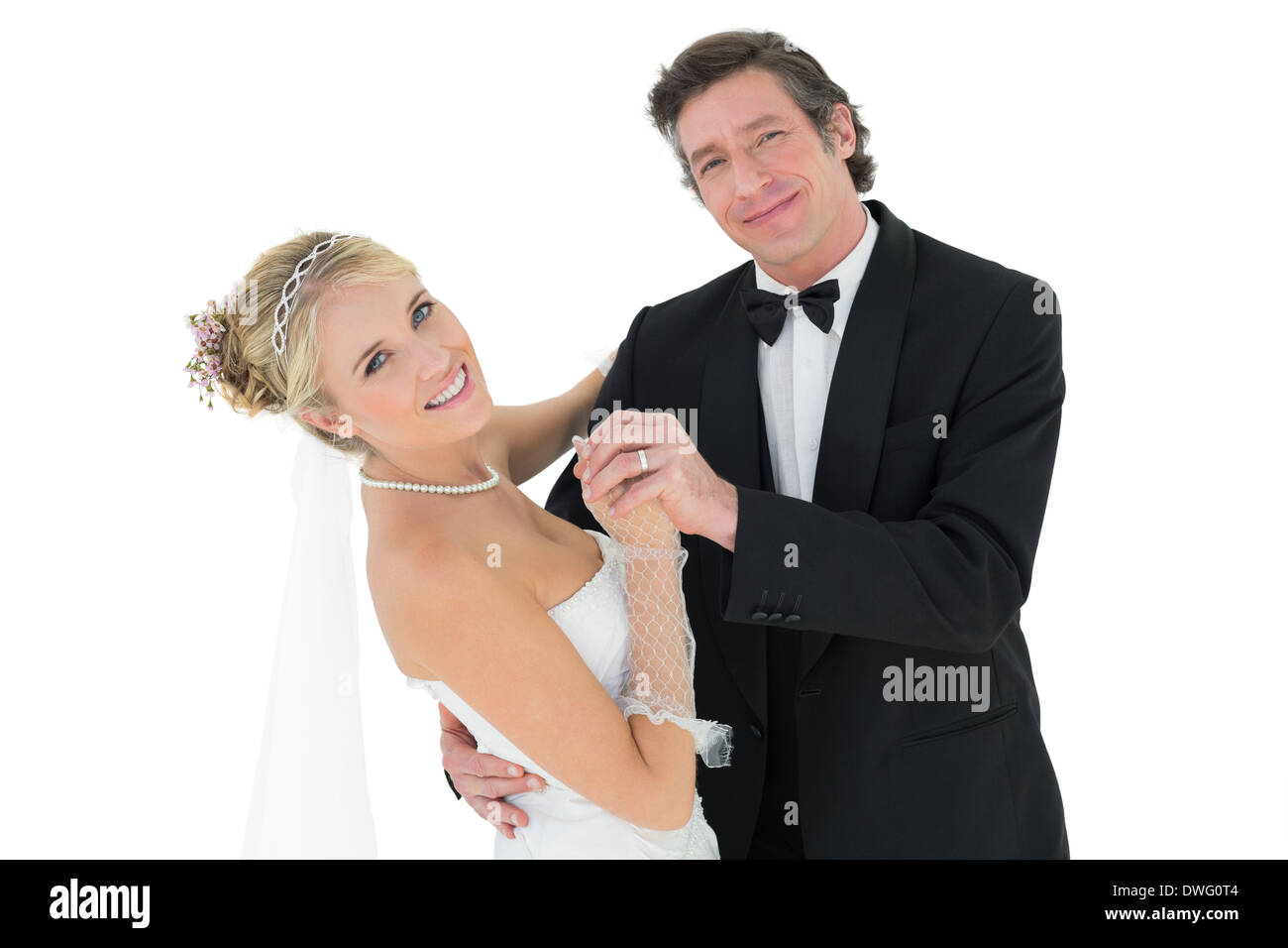 Happy couple dancing over white background Stock Photo