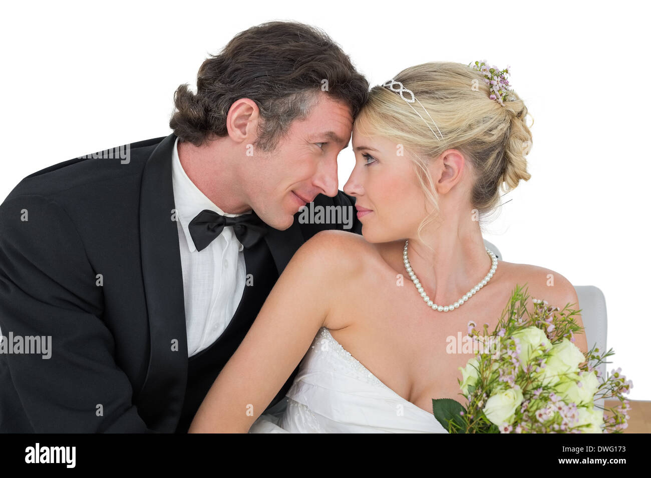 Loving newly wed couple with head to head Stock Photo