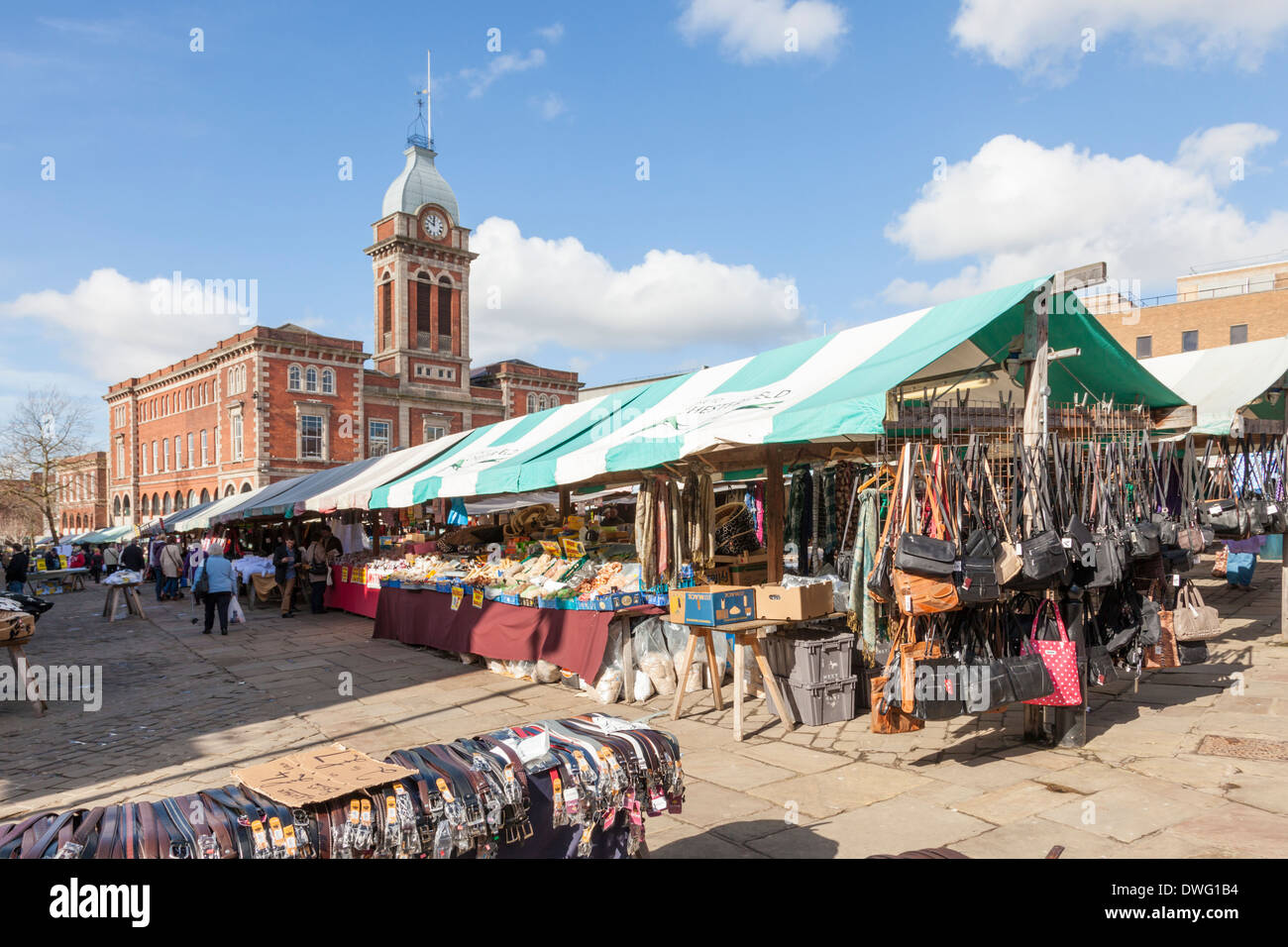 Outdoor market stalls. Leather goods on sale at Chesterfield Market with the Market Hall in the distance. Chesterfield, Derbyshire, England, UK Stock Photo