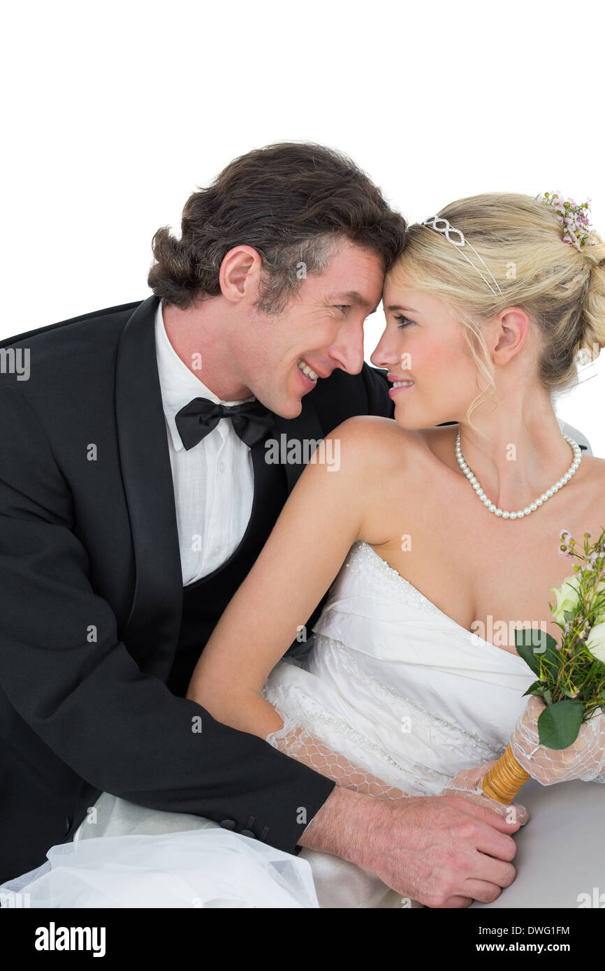 Attractive bride and groom with head to head Stock Photo