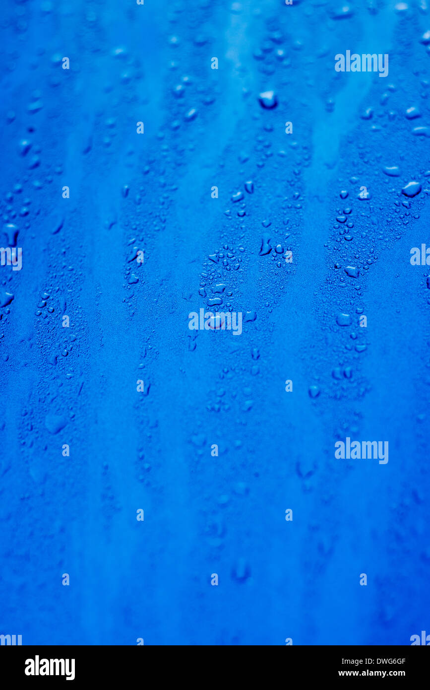 Water droplets on a blue surface Stock Photo - Alamy