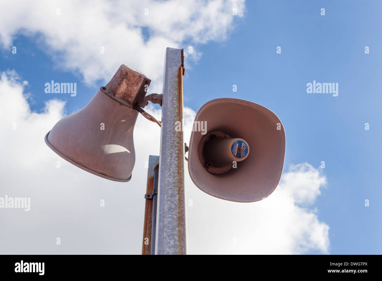 Looking up at Atlas Soundolier outdoor public address system (P A system) speakers, England, UK Stock Photo