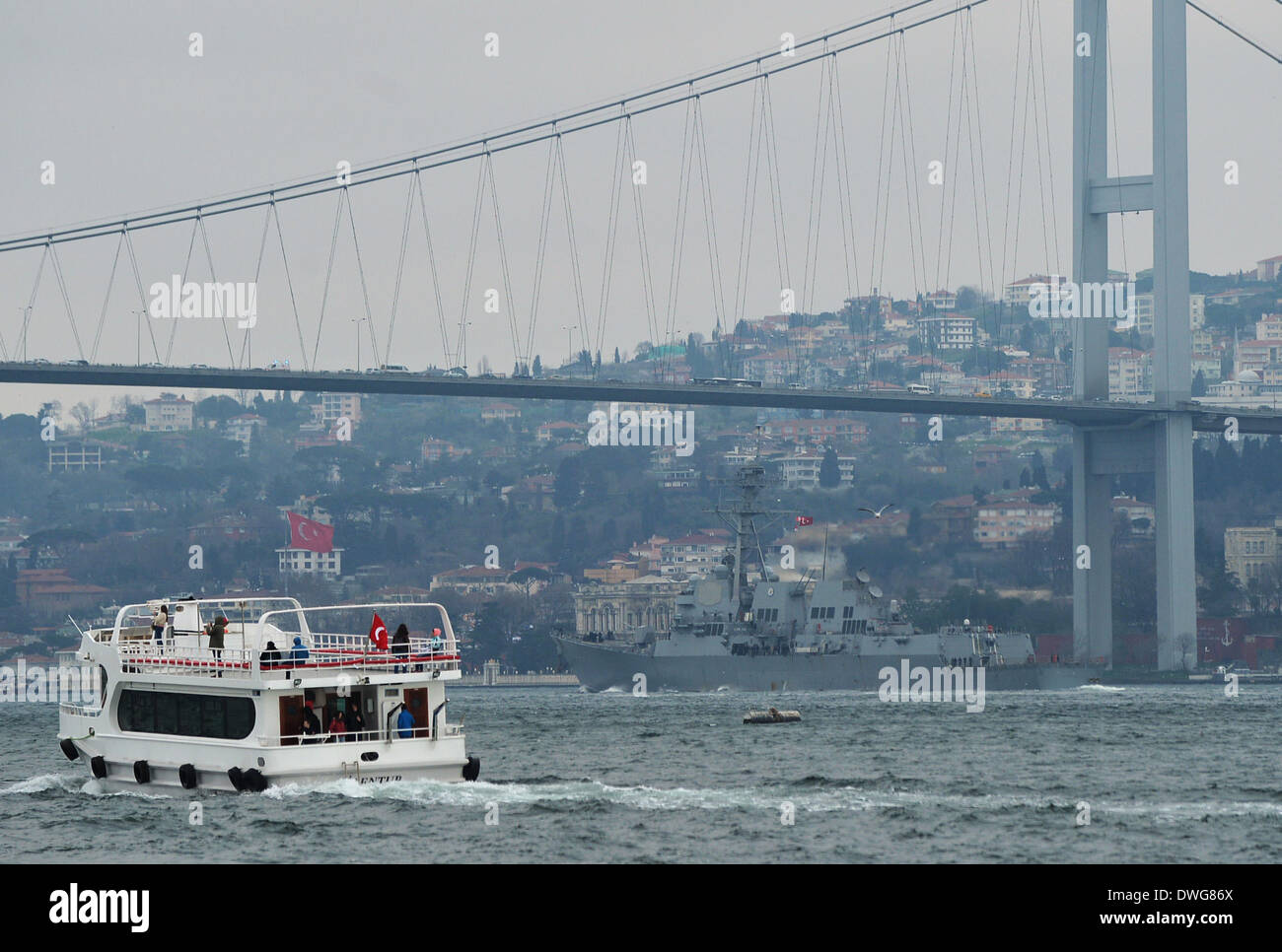Istanbul, Turkey. 7th Mar, 2014. The U.S. guided-missile destroyer USS Truxtun (back) is seen passing through the Bosphorus strait in Istanbul, Turkey, March 7, 2014. A U.S. guided-missile destroyer USS Truxtun is passing through the Bosphorus strait in Istanbul on Friday afternoon on its way to Black Sea. It will participate in a tactical drill in the northwestern part of the Black Sea on March 11, along with one frigate from Bulgaria and three ships from Romania. Credit:  Lu Zhe/Xinhua/Alamy Live News Stock Photo