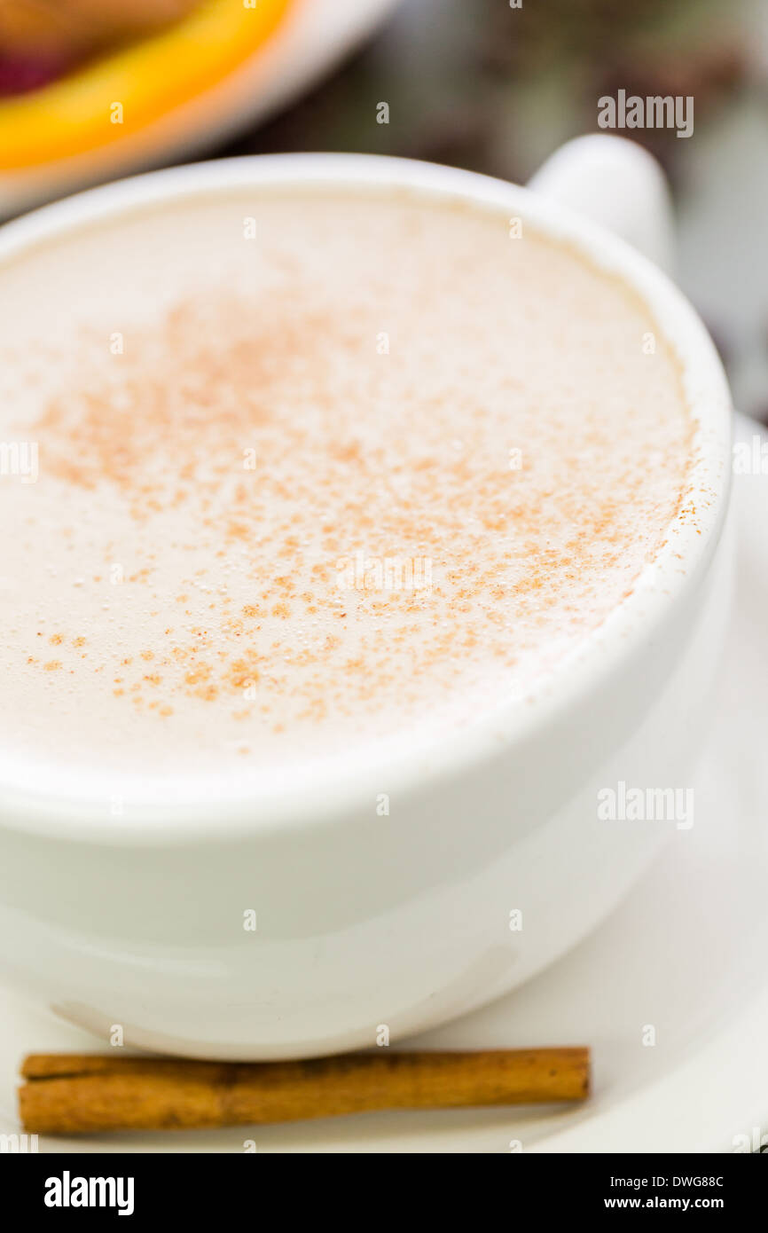 Chai tea latte with cinnamon stick Stock Photo Alamy